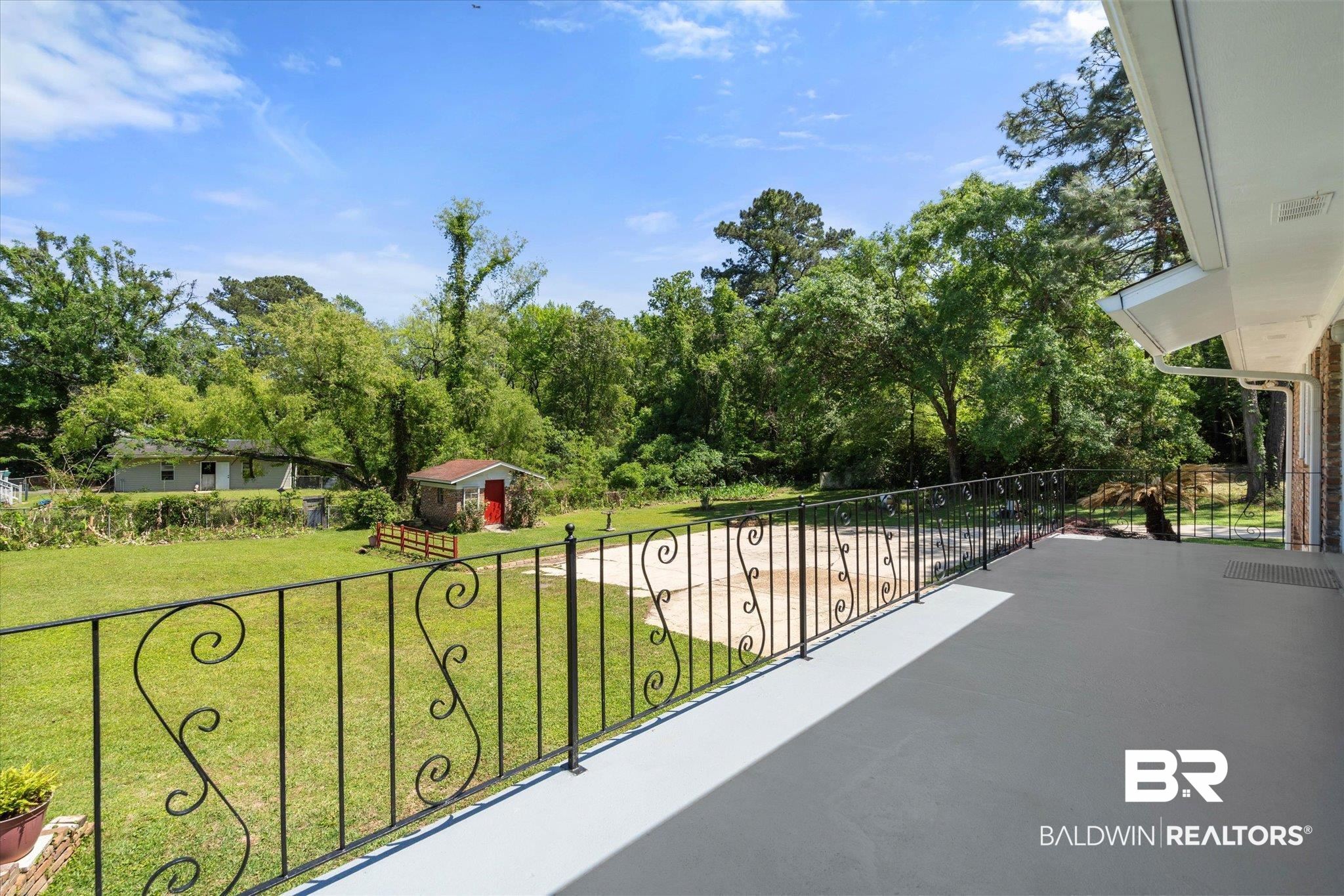 706 Sutherland Drive Chickasaw, AL 36611 - Photo 5 of 33 Balcony featuring a patio area