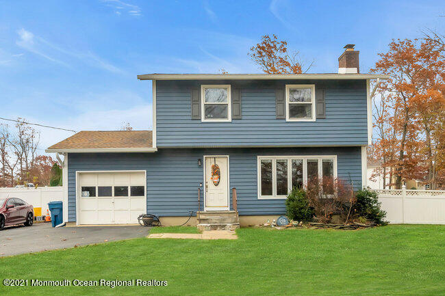 505 South Cooks Bridge Road Jackson, NJ 08527 - Photo 1 of 30 a front view of a house with a garden and yard