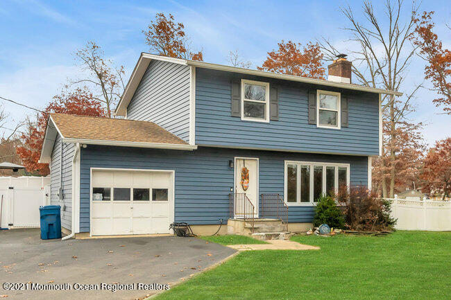 505 South Cooks Bridge Road Jackson, NJ 08527 - Photo 2 of 30 a front view of a house with a garden