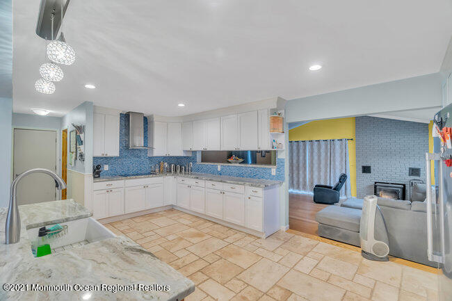 505 South Cooks Bridge Road Jackson, NJ 08527 - Photo 11 of 30 a kitchen with sink and white cabinets
