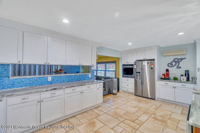 505 South Cooks Bridge Road Jackson, NJ 08527 - Photo 12 of 30 a kitchen with stainless steel appliances granite countertop a refrigerator sink and cabinets