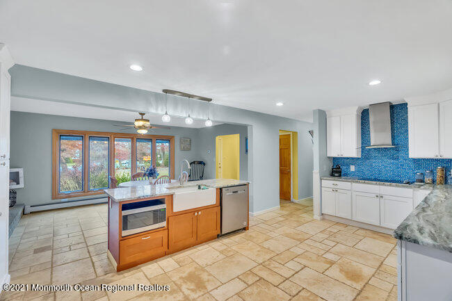 505 South Cooks Bridge Road Jackson, NJ 08527 - Photo 13 of 30 a large kitchen with kitchen island a sink stainless steel appliances and cabinets