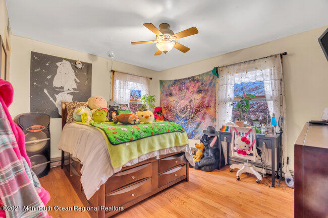 505 South Cooks Bridge Road Jackson, NJ 08527 - Photo 24 of 30 a bedroom with a bed and a chandelier