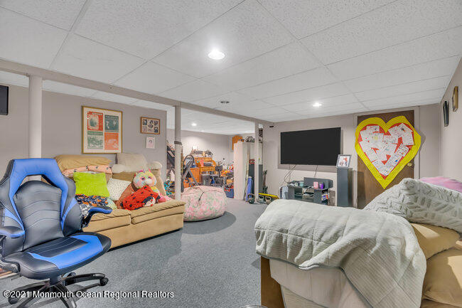 505 South Cooks Bridge Road Jackson, NJ 08527 - Photo 25 of 30 a bed room with furniture and a flat screen tv