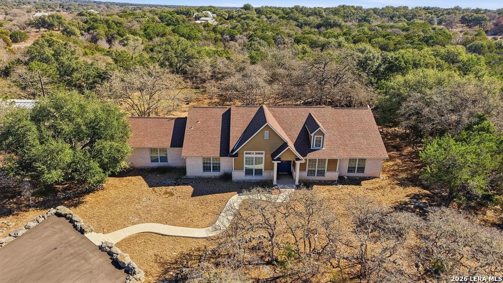 318 River Ridge Boerne, TX 78006 - Photo 38 of 46 an aerial view of a house with swimming pool and mountain view