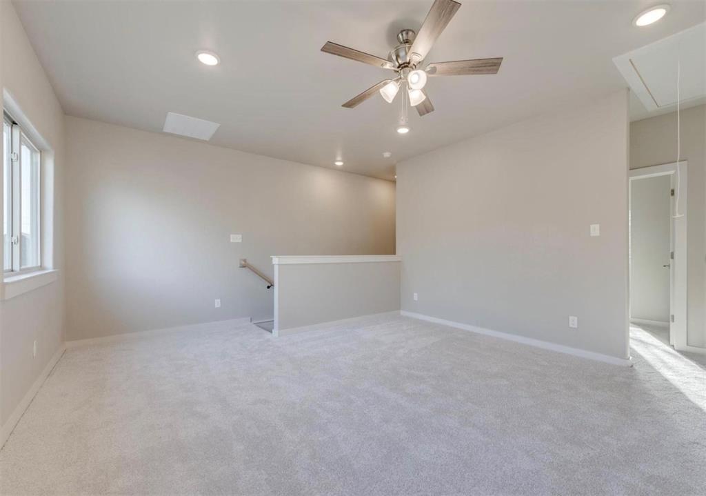 100 Hackberry Lane Roanoke, TX 76262 - Photo 9 of 10 en empty room with windows and fan