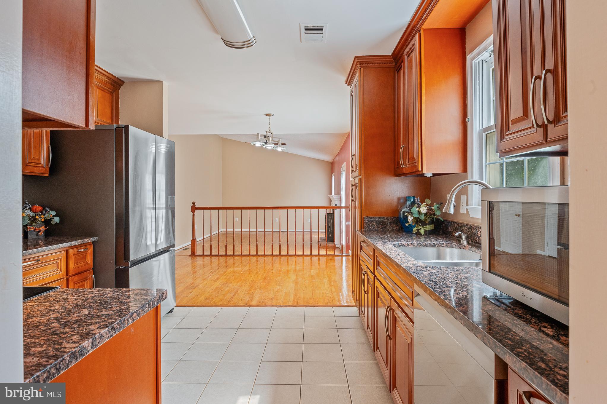 9 Coachlamp Court Silver Spring, MD 20906 - Photo 14 of 95 a kitchen with stainless steel appliances granite countertop a refrigerator and a stove