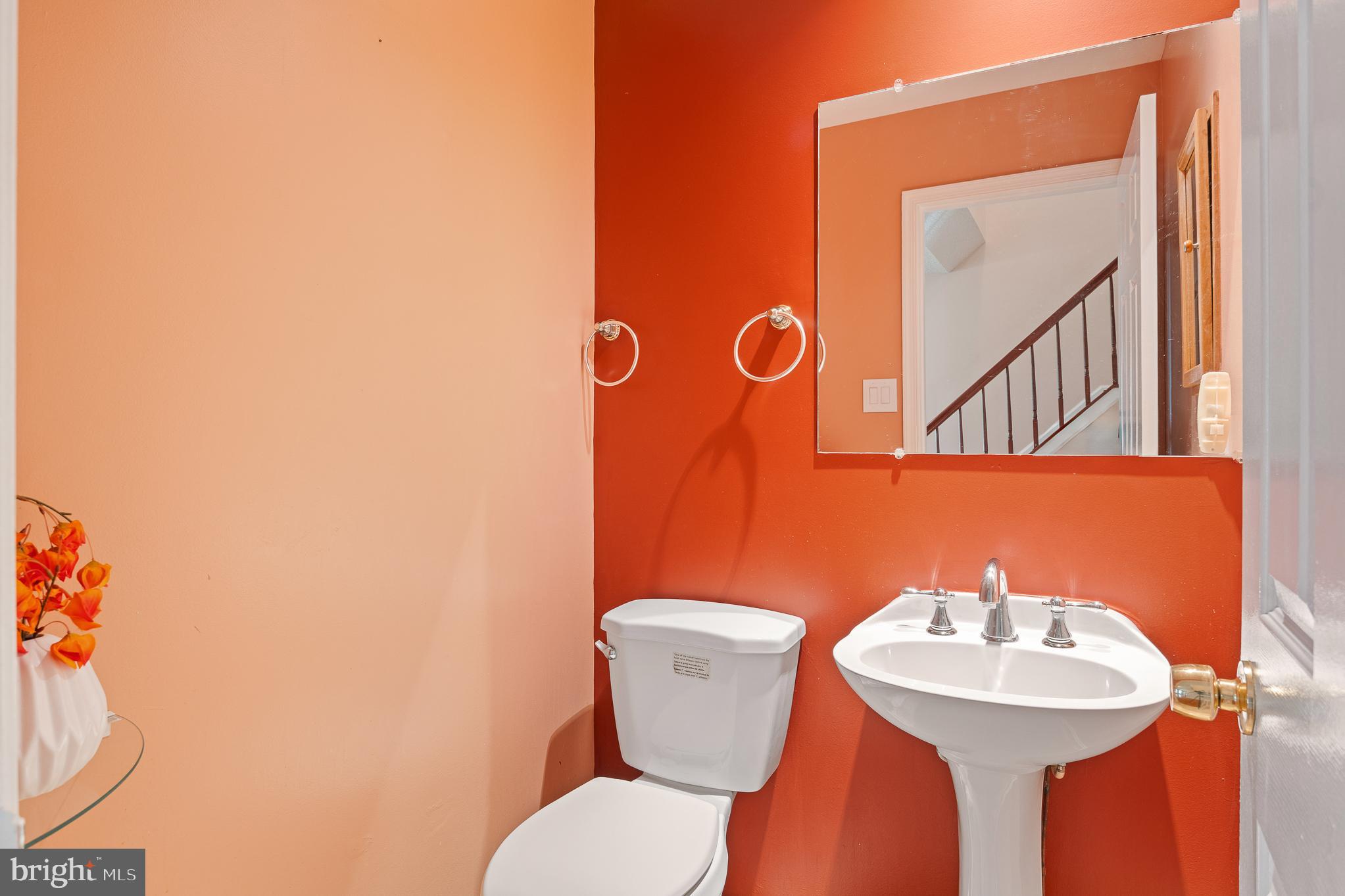 9 Coachlamp Court Silver Spring, MD 20906 - Photo 28 of 95 a bathroom with a toilet sink and mirror