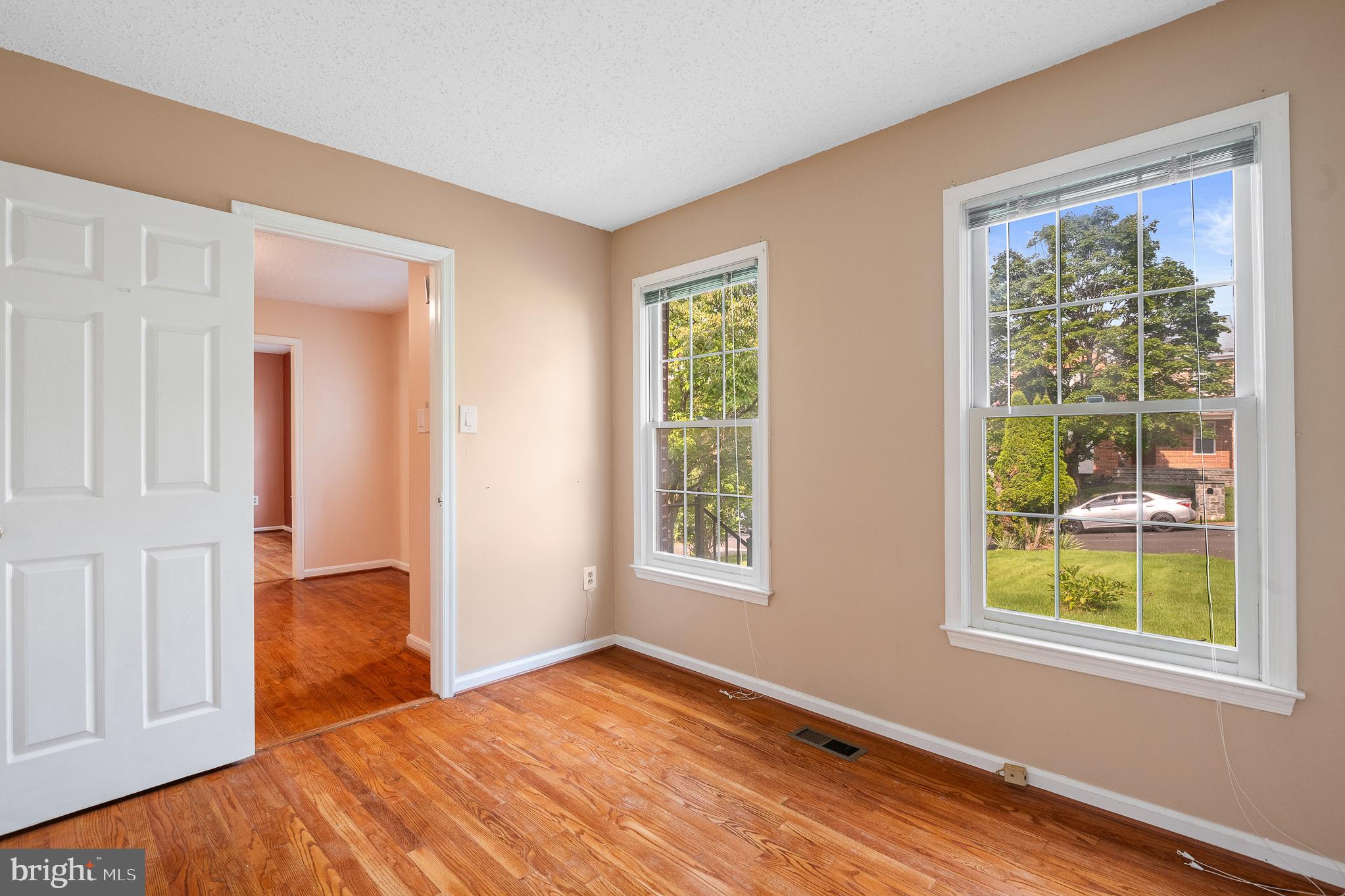 9 Coachlamp Court Silver Spring, MD 20906 - Photo 29 of 95 a view of an empty room with window and wooden floor
