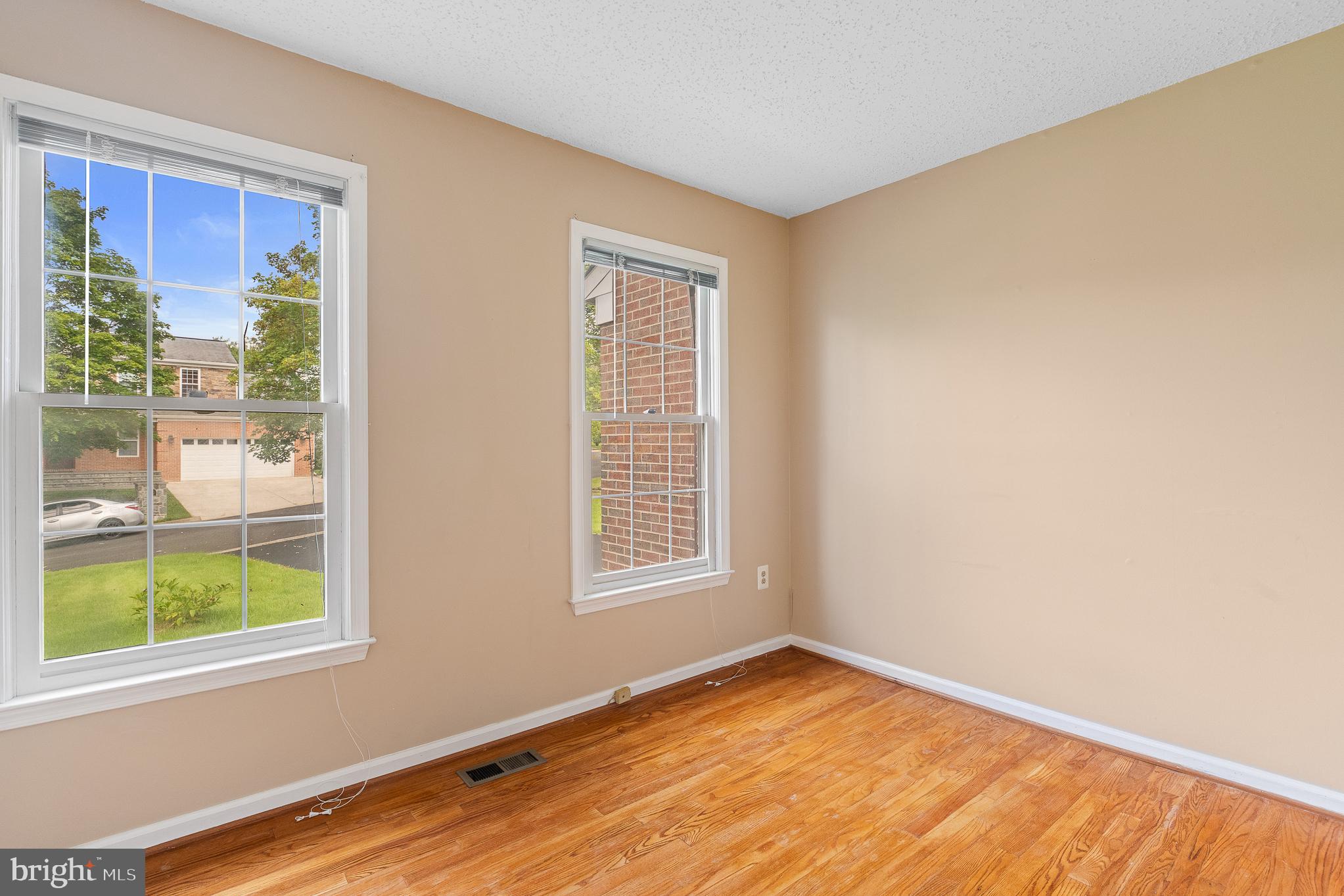 9 Coachlamp Court Silver Spring, MD 20906 - Photo 30 of 95 a view of an empty room with wooden floor and a window