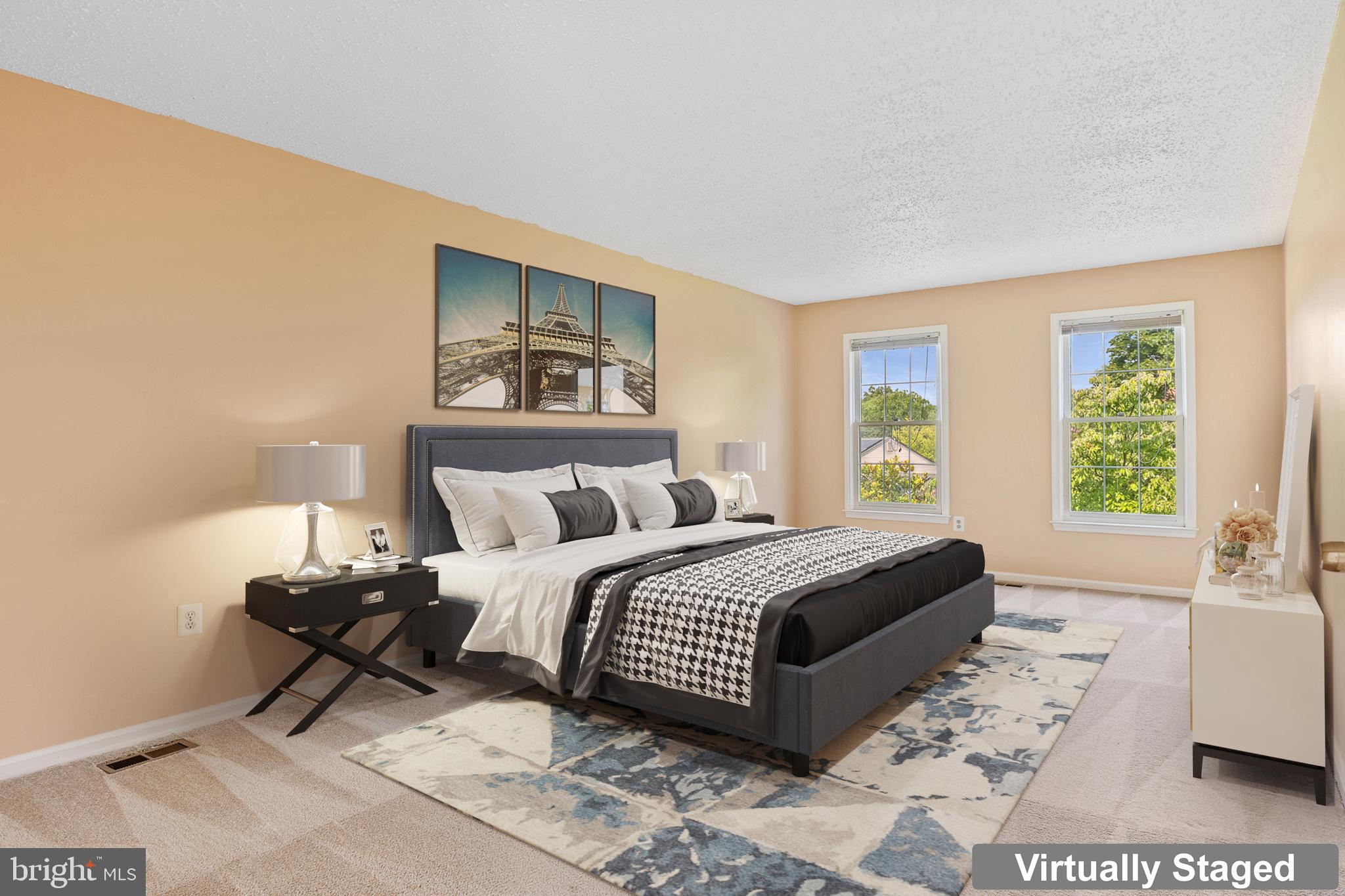 9 Coachlamp Court Silver Spring, MD 20906 - Photo 34 of 95 a spacious bedroom with a bed and a couch