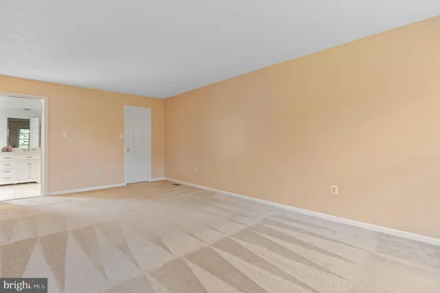 a view of a bathroom from a hallway