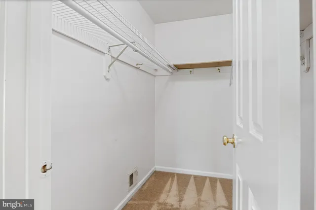 a room with furniture pool table and windows