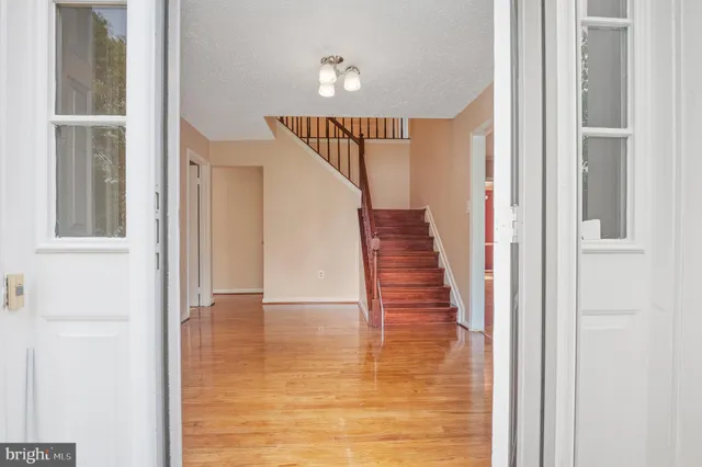 a living room with furniture rug and window