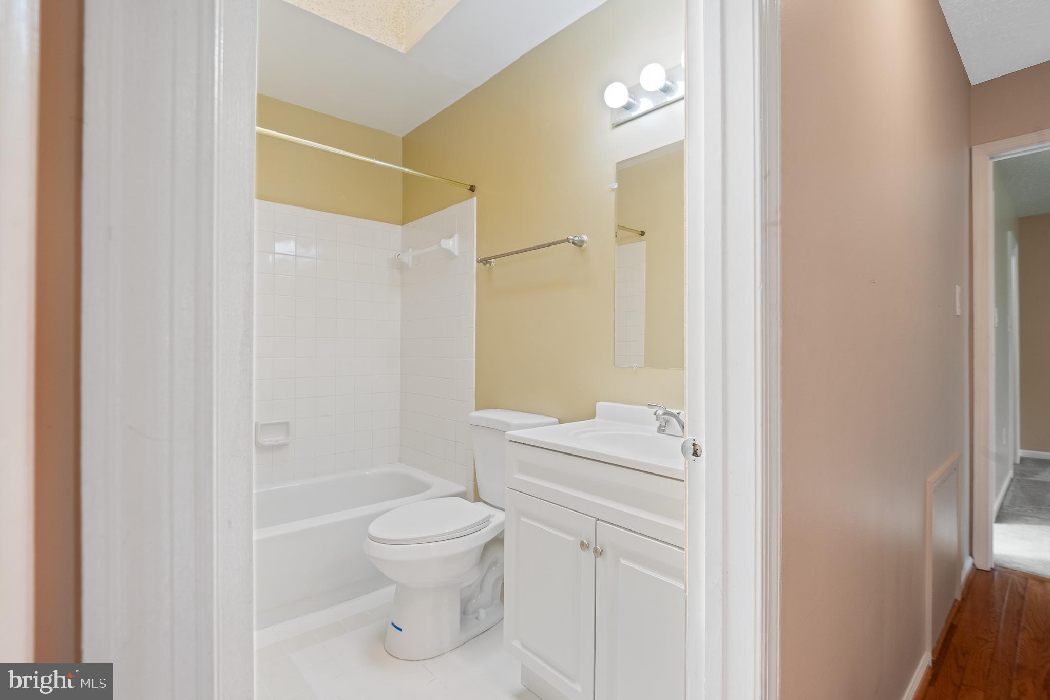 9 Coachlamp Court Silver Spring, MD 20906 - Photo 50 of 95 a bathroom with a toilet sink vanity and shower