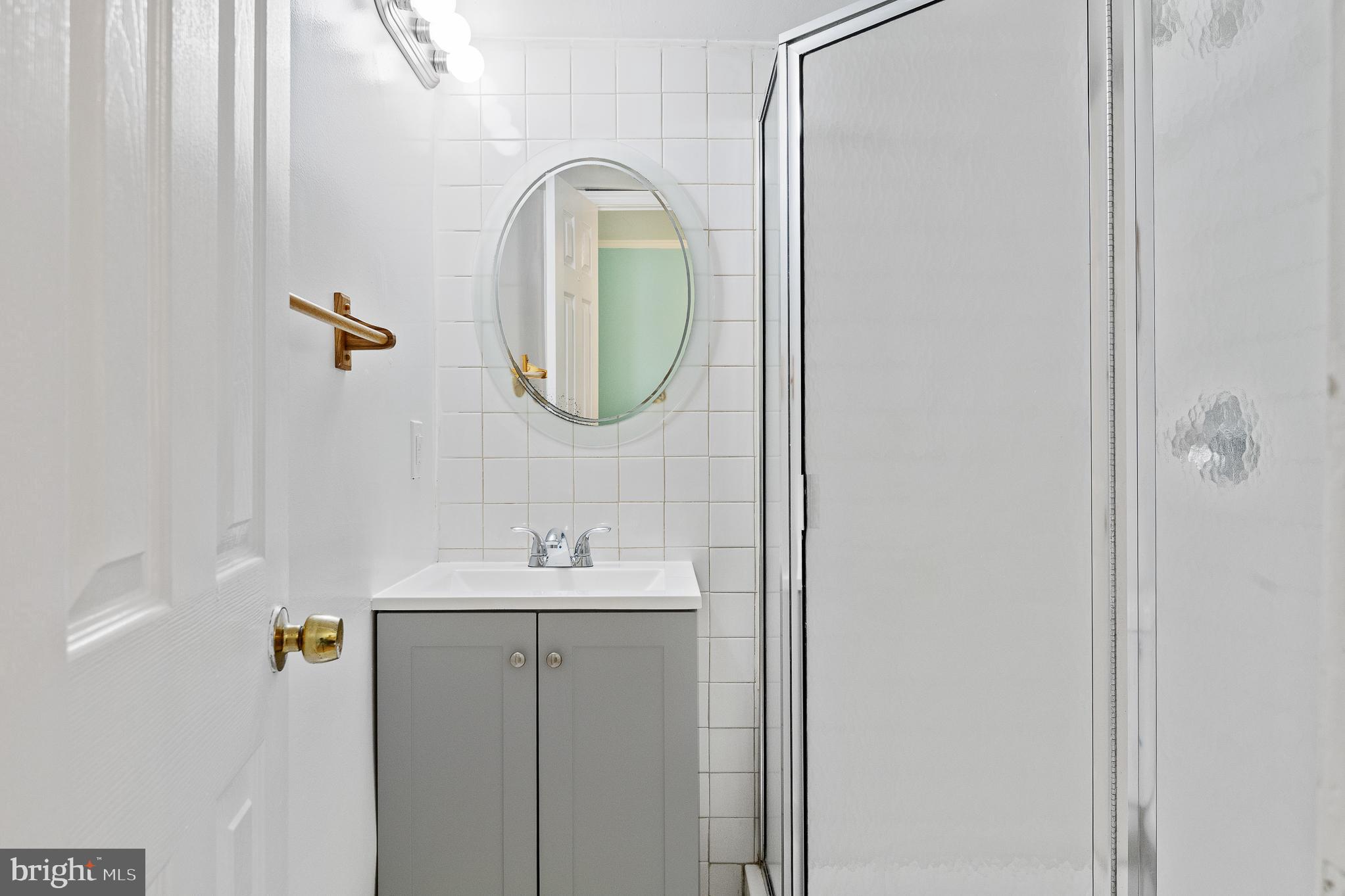 9 Coachlamp Court Silver Spring, MD 20906 - Photo 64 of 95 a bathroom with a sink and mirror