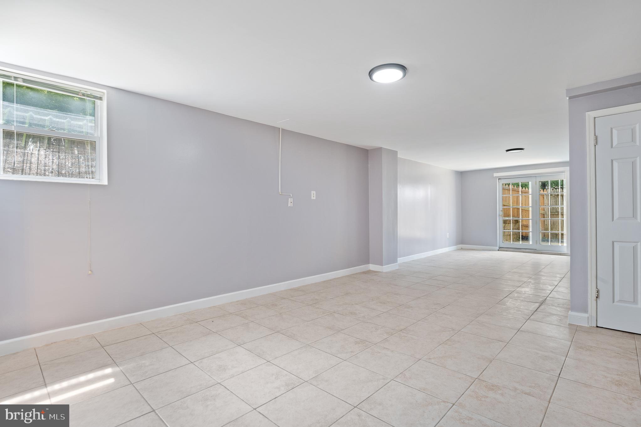 9 Coachlamp Court Silver Spring, MD 20906 - Photo 66 of 95 a view of an empty room with window and chandelier fan