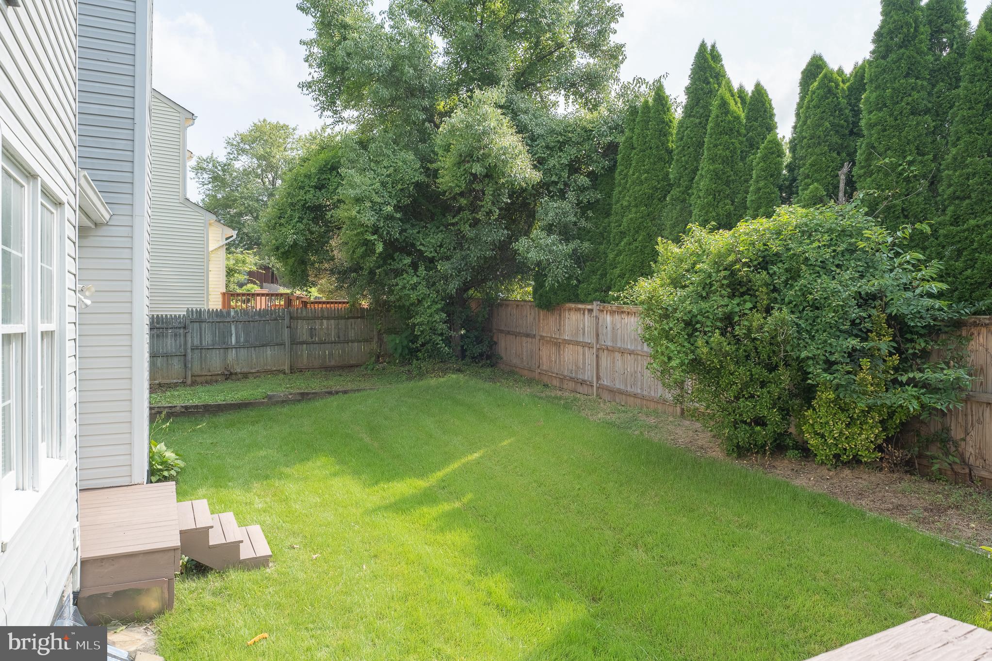 9 Coachlamp Court Silver Spring, MD 20906 - Photo 85 of 95 a backyard of a house with lots of green space