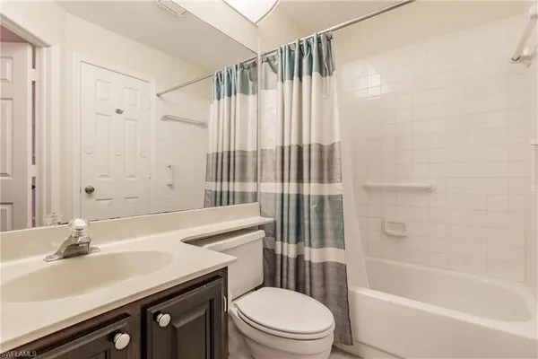 a bathroom with a sink a toilet and a bathtub