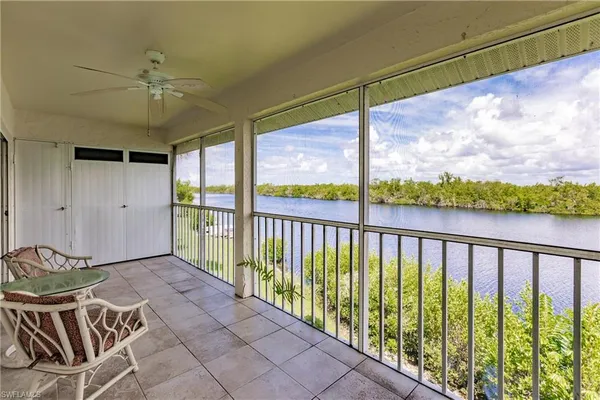 a view of a balcony with furniture