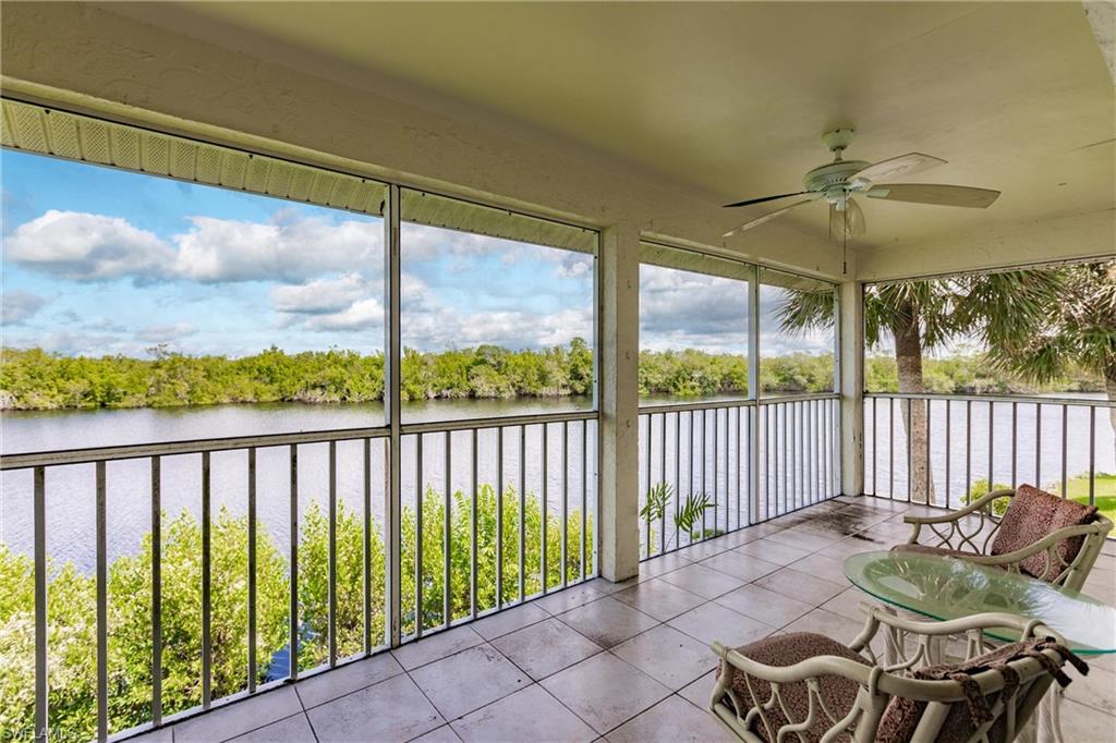 1315 Mainsail Drive, Unit 1115 Naples, FL 34114 - Photo 22 of 25 a balcony with table and chairs