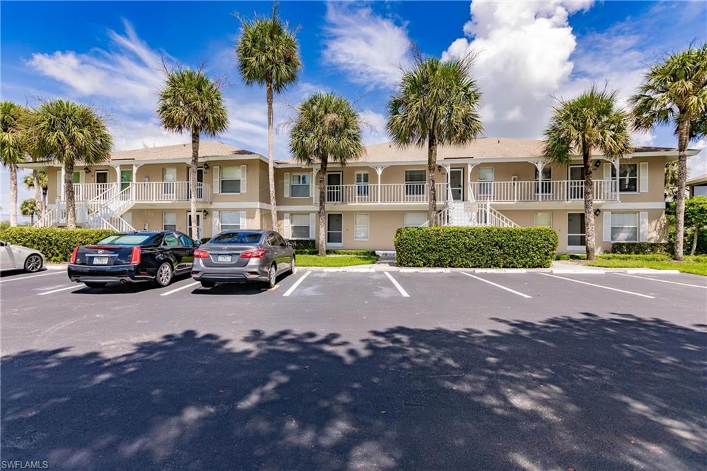 1315 Mainsail Drive, Unit 1115 Naples, FL 34114 - Photo 24 of 25 a view of street with parked cars