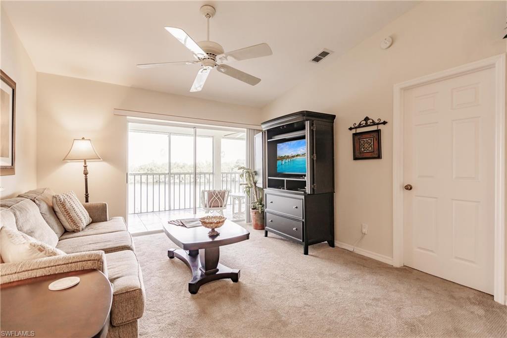 1315 Mainsail Drive, Unit 1115 Naples, FL 34114 - Photo 8 of 25 a living room with furniture and a large window