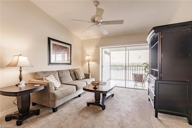 a living room with furniture a window and a table