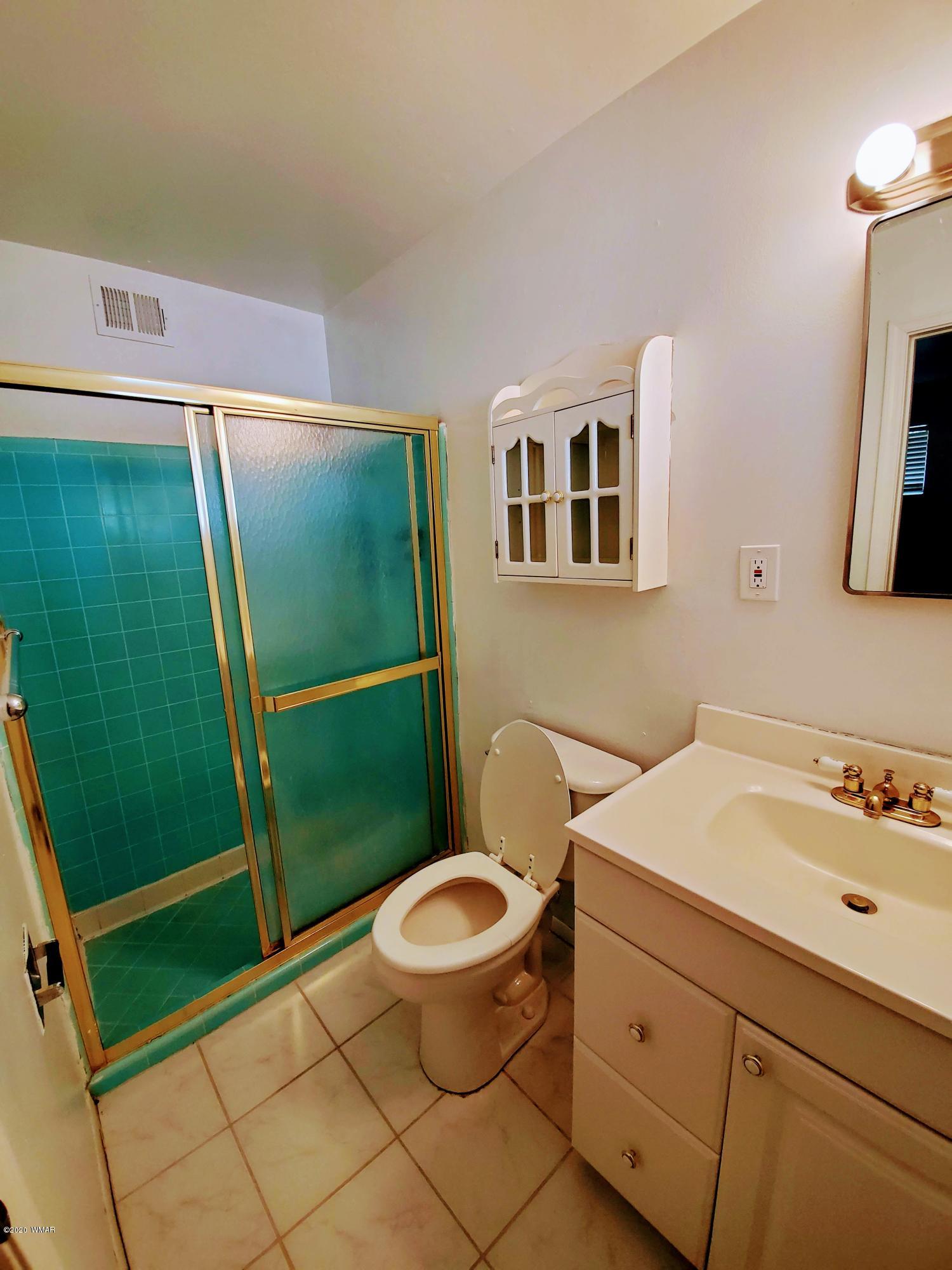 300 South 8th Street Snowflake, AZ 85937 - Photo 11 of 18 a bathroom with a sink and a mirror
