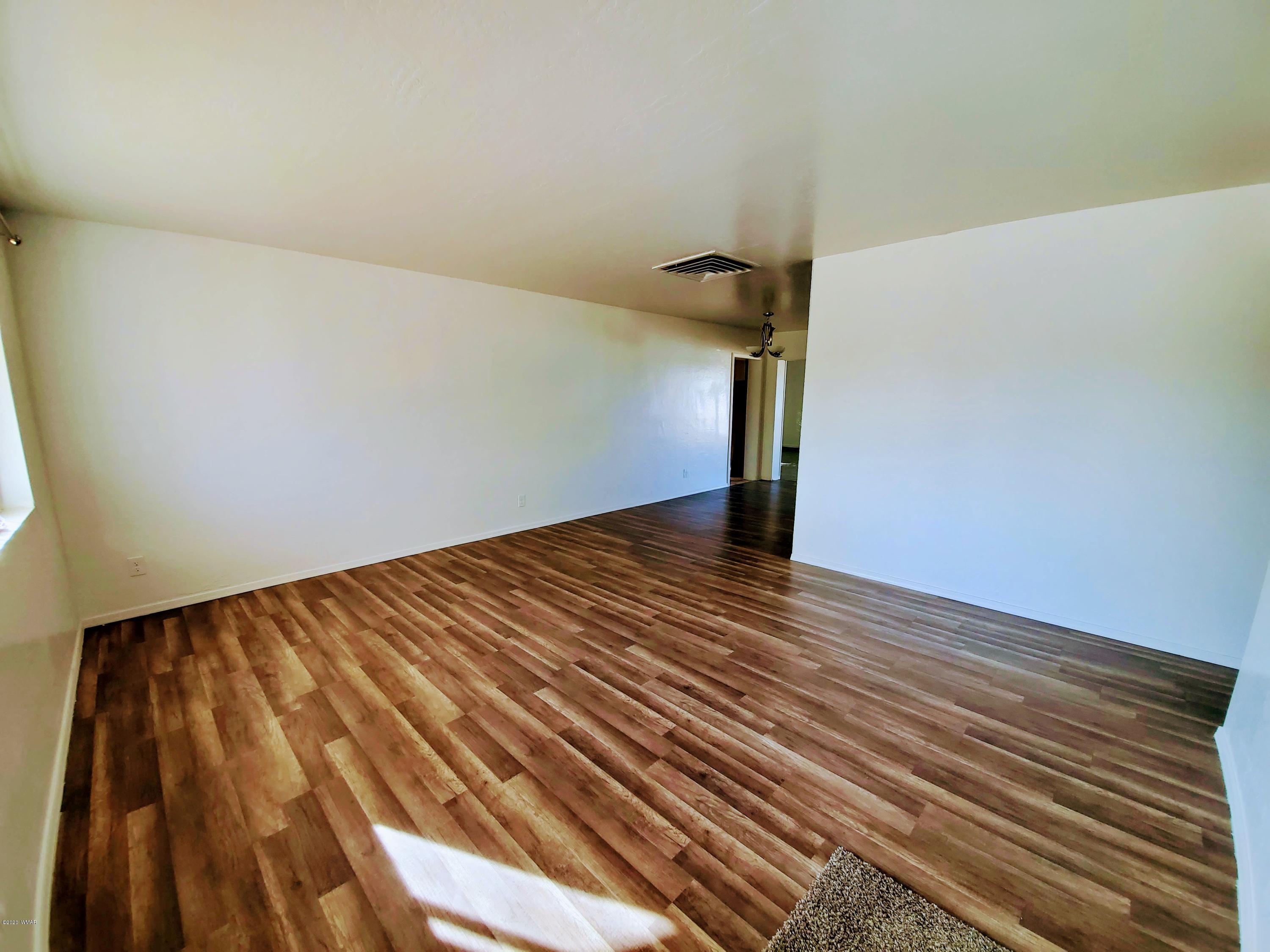 300 South 8th Street Snowflake, AZ 85937 - Photo 2 of 18 a view of a room with wooden floor