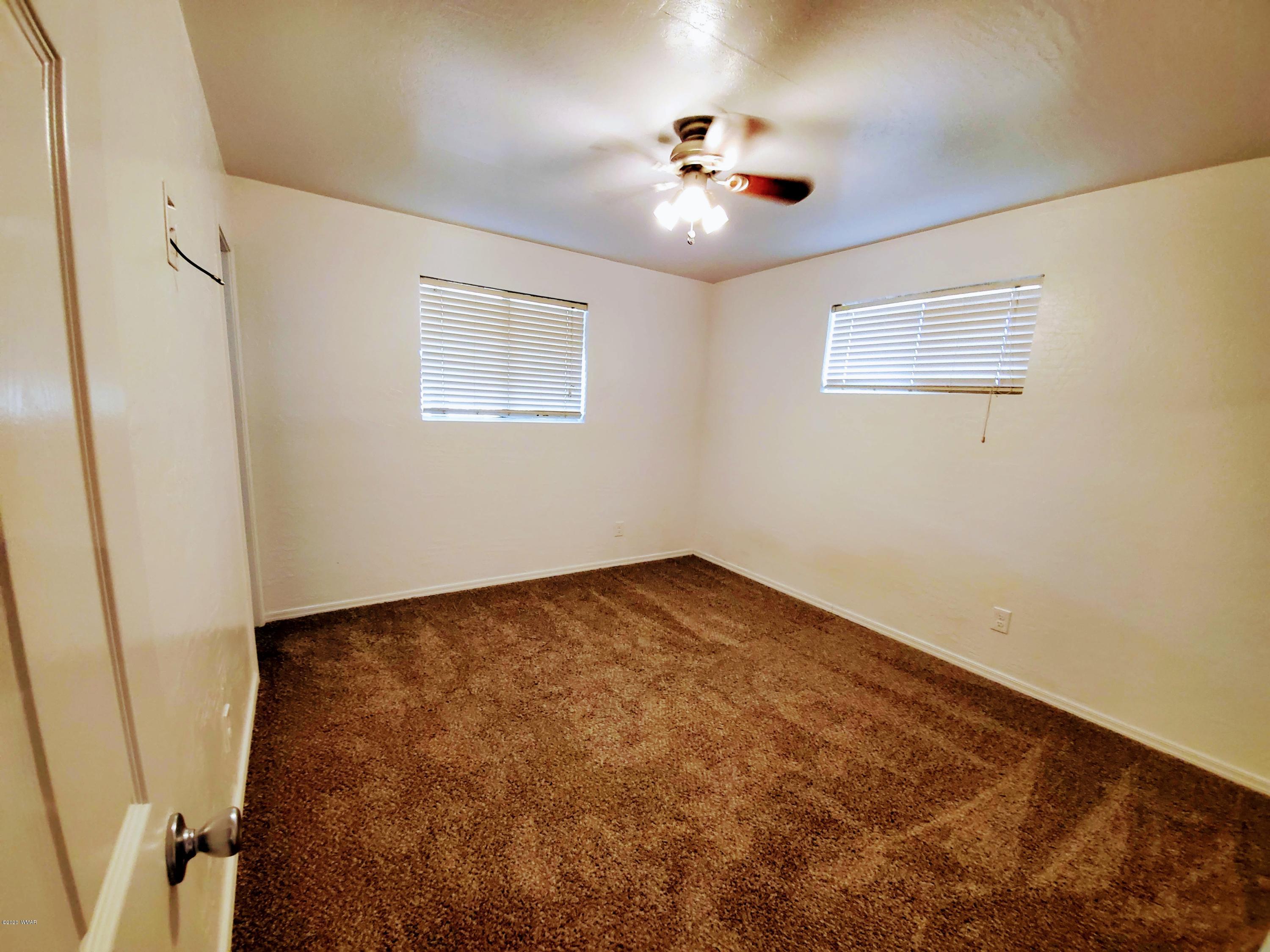 300 South 8th Street Snowflake, AZ 85937 - Photo 10 of 18 a view of empty room with a fan