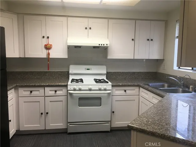 a bathroom with a sink and vanity