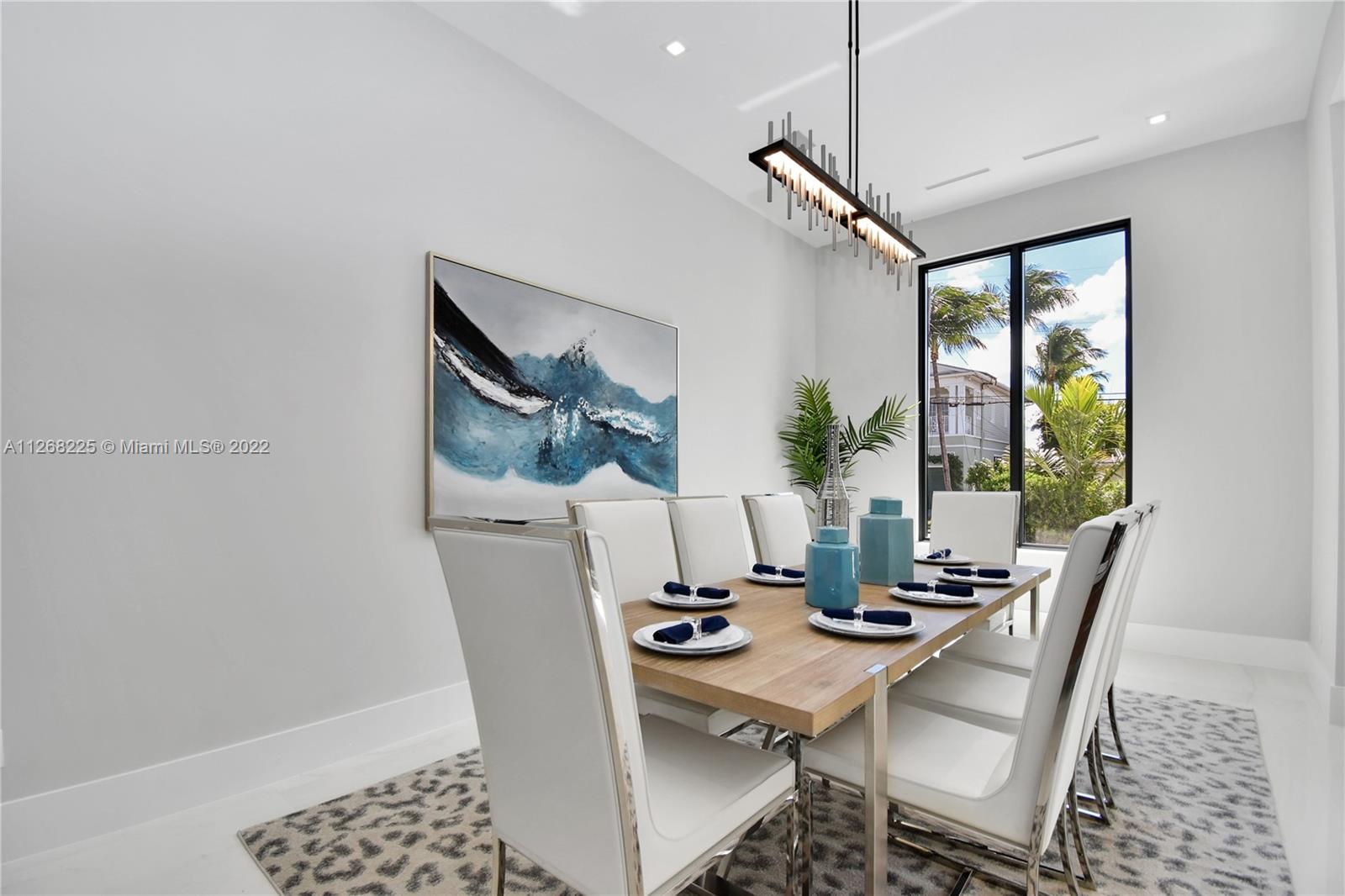 805 Northeast 70th Street Boca Raton, FL 33487 - Photo 49 of 63 a view of a dining room with furniture window and outside view