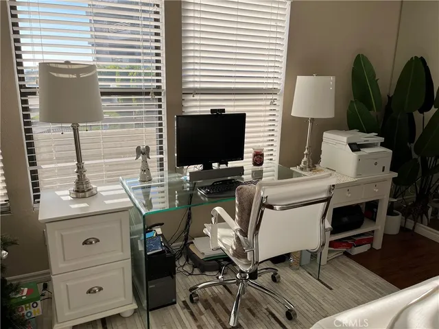 a view of a workspace with furniture