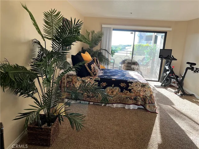 a bed room with a bed and a window