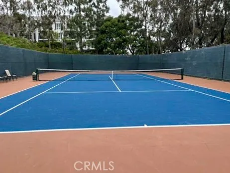 a view of a swimming pool with outdoor seating