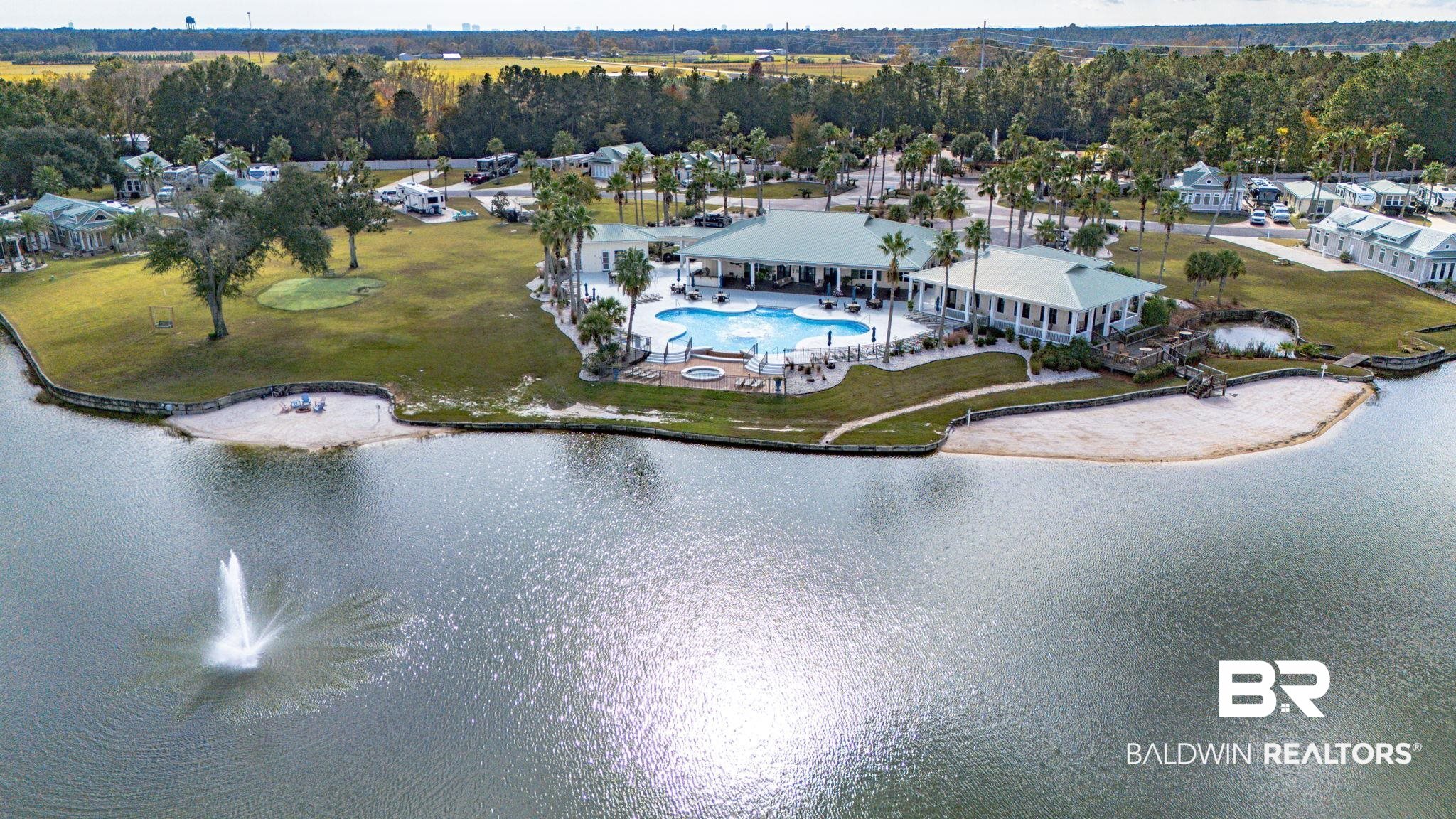 12004 Raptor Court Elberta, AL 36530 - Photo 43 of 57 Aerial view of a pool and a nearby body of water