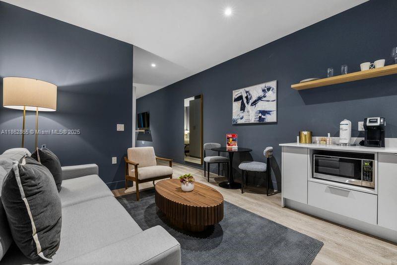 239 Southwest 9th Street, Unit 602 Miami, FL 33130 - Photo 4 of 18 a living room with furniture and a couch