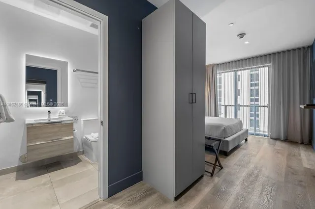 a room with a chair and a mirror