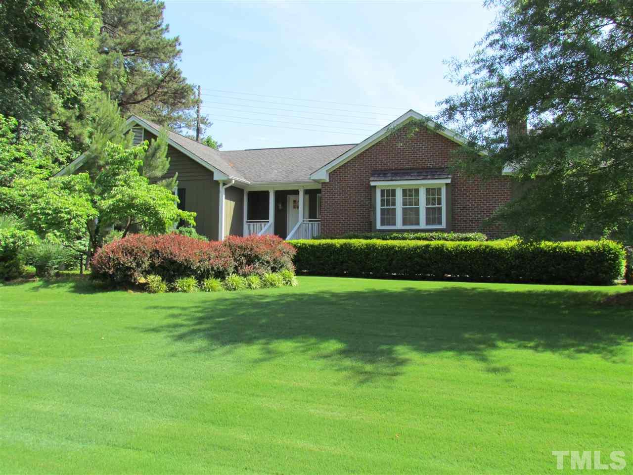 8412 Two Courts Drive Raleigh, NC 27613 - Photo 2 of 25 a front view of house with yard and green space