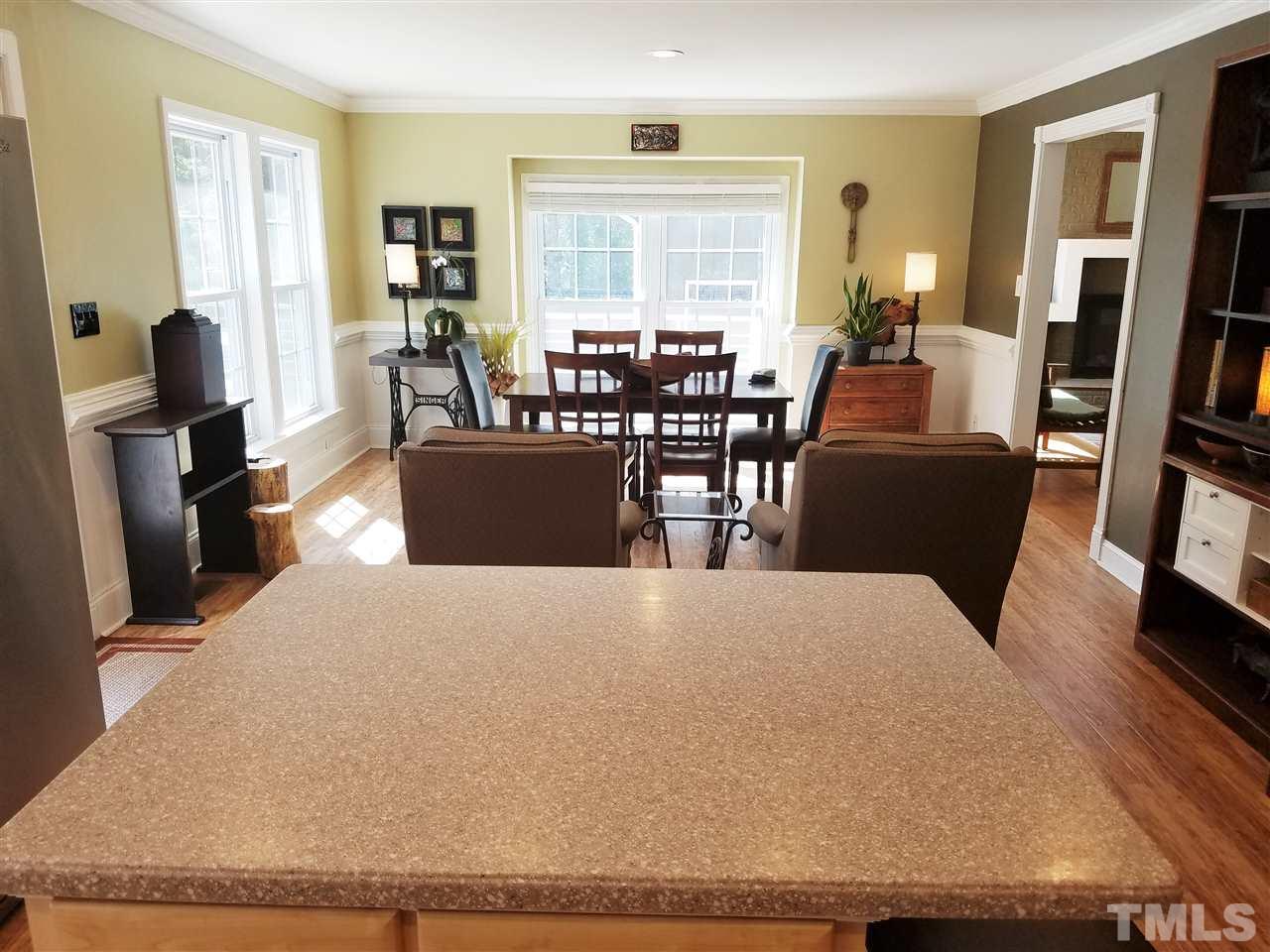 8412 Two Courts Drive Raleigh, NC 27613 - Photo 11 of 25 a living room with furniture window and wooden floor