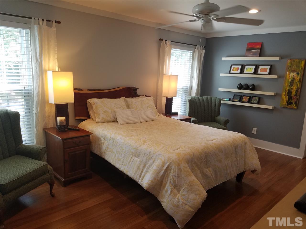 8412 Two Courts Drive Raleigh, NC 27613 - Photo 18 of 25 a bedroom with a bed furniture and a window