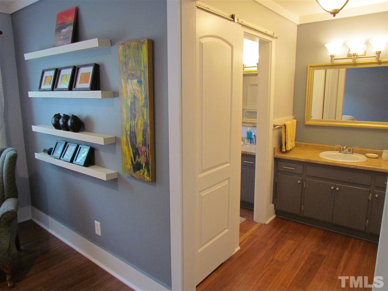 8412 Two Courts Drive Raleigh, NC 27613 - Photo 19 of 25 a view of walk in closet with clothes and shoes