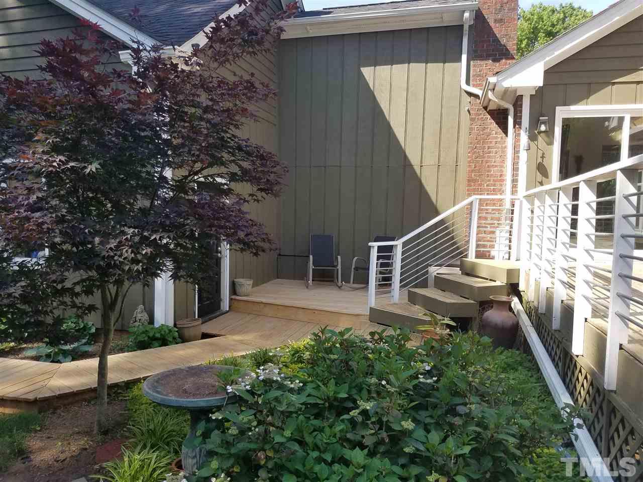 8412 Two Courts Drive Raleigh, NC 27613 - Photo 22 of 25 a view of a house with backyard and sitting area