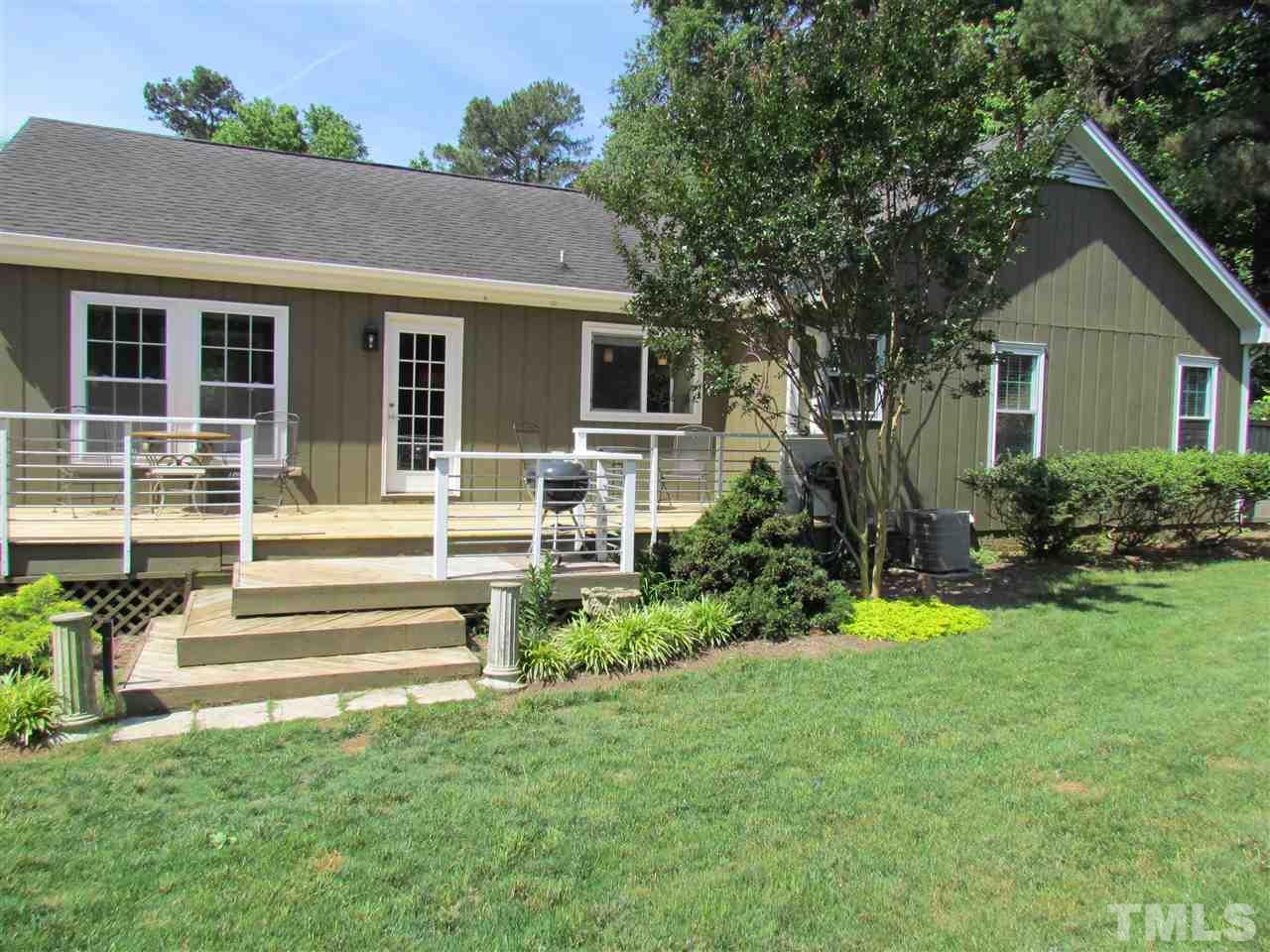 8412 Two Courts Drive Raleigh, NC 27613 - Photo 23 of 25 a view of a house with a yard