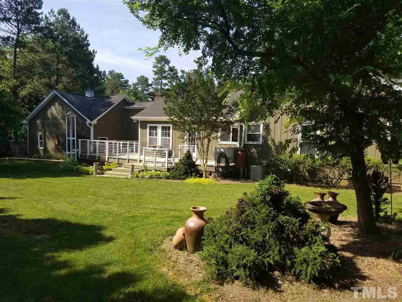 8412 Two Courts Drive Raleigh, NC 27613 - Photo 25 of 25 a front view of a house with a garden