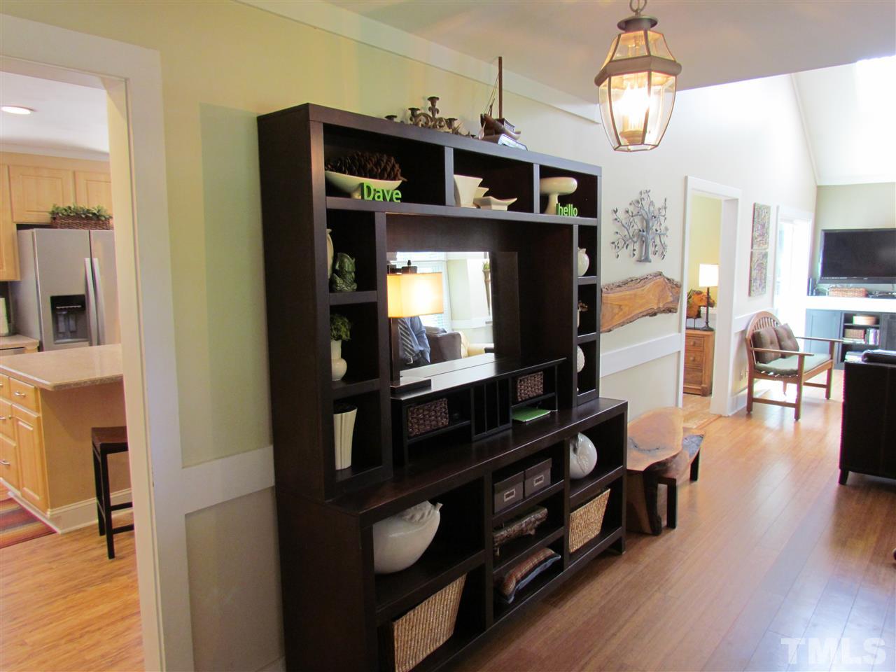 8412 Two Courts Drive Raleigh, NC 27613 - Photo 5 of 25 a view of living room with furniture and wooden floor