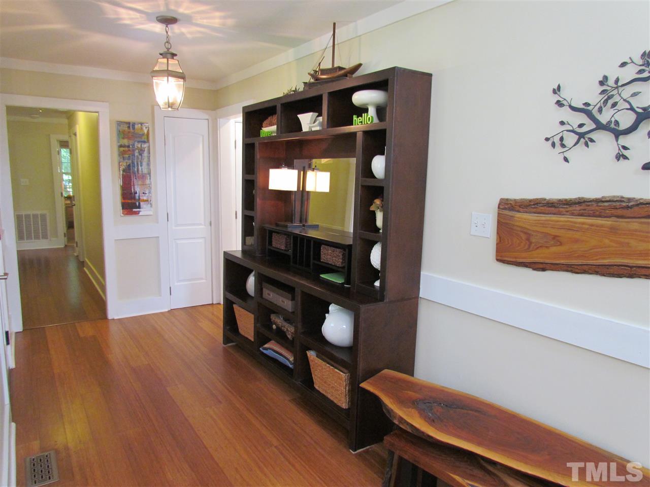 8412 Two Courts Drive Raleigh, NC 27613 - Photo 6 of 25 a view of a room with wooden floor and staircase