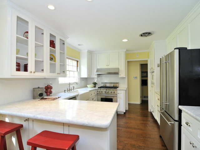 95 Reservoir Road Atherton, CA 94027 - Photo 5 of 10 a kitchen with stainless steel appliances a sink stove refrigerator and cabinets