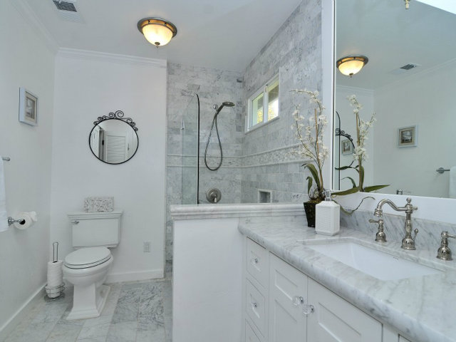 95 Reservoir Road Atherton, CA 94027 - Photo 8 of 10 a bathroom with a granite countertop sink mirror vanity and toilet